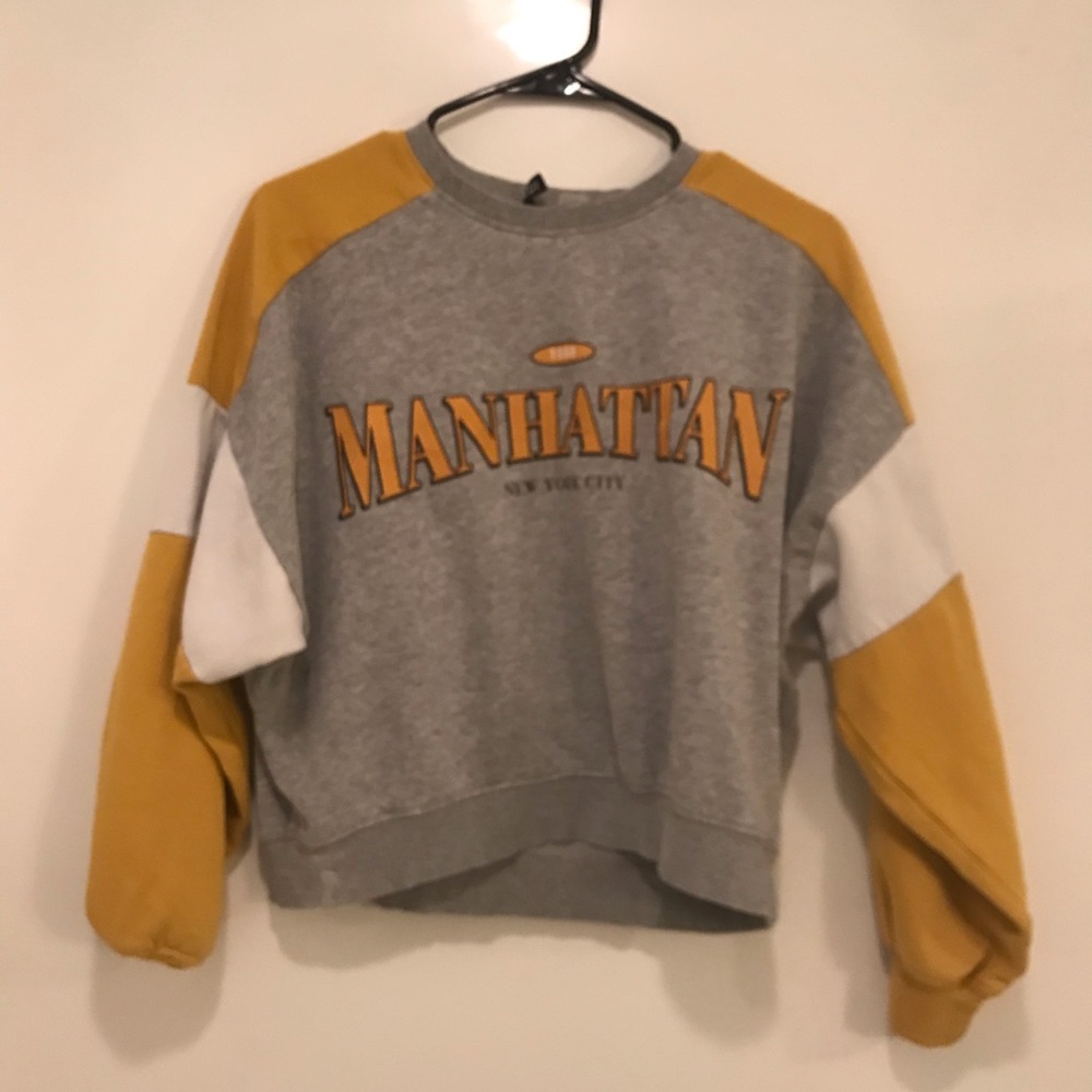 Manhattan gray, white, and yellow sweatshirt